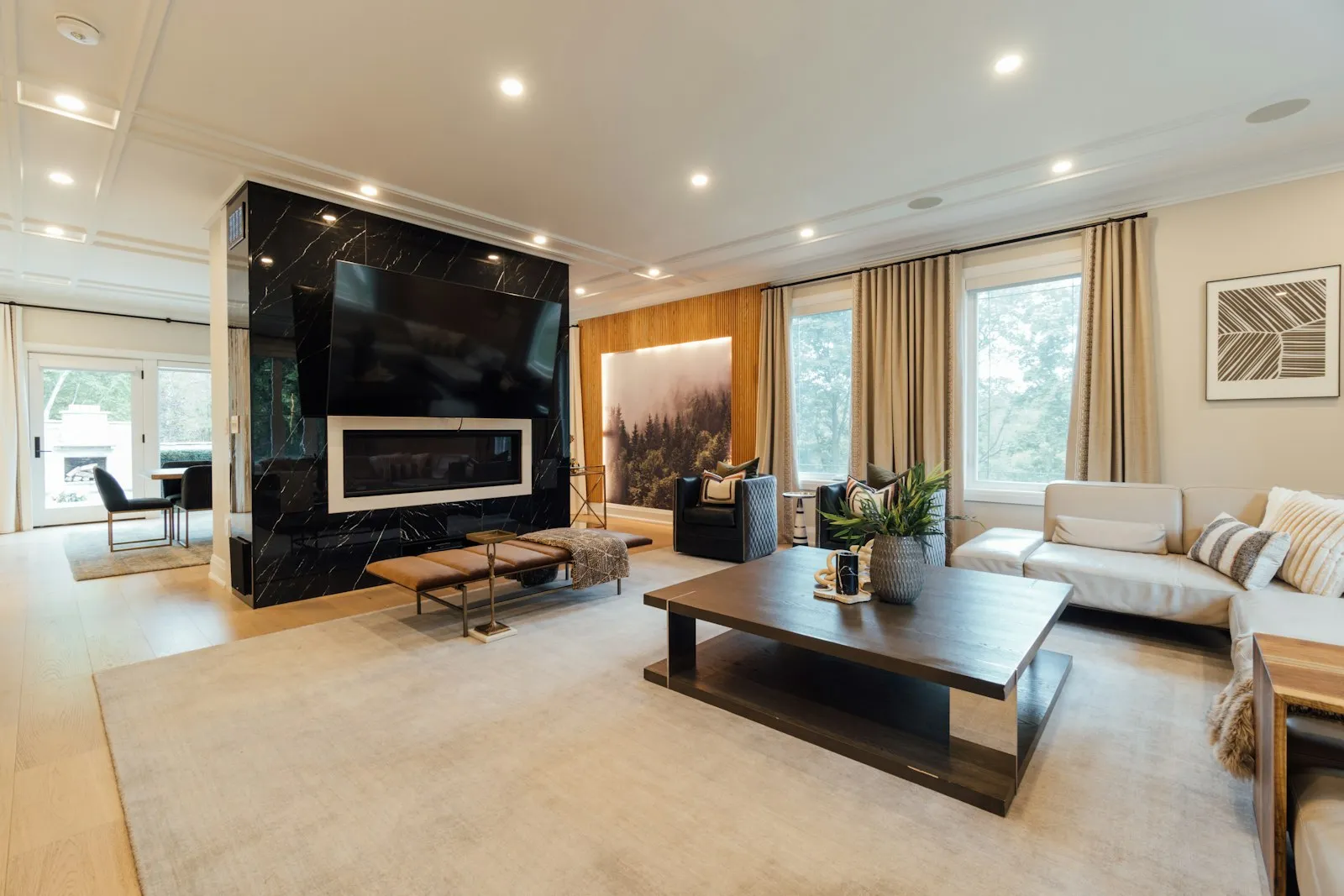 Warm LED downlights installed across a modern living room ceiling