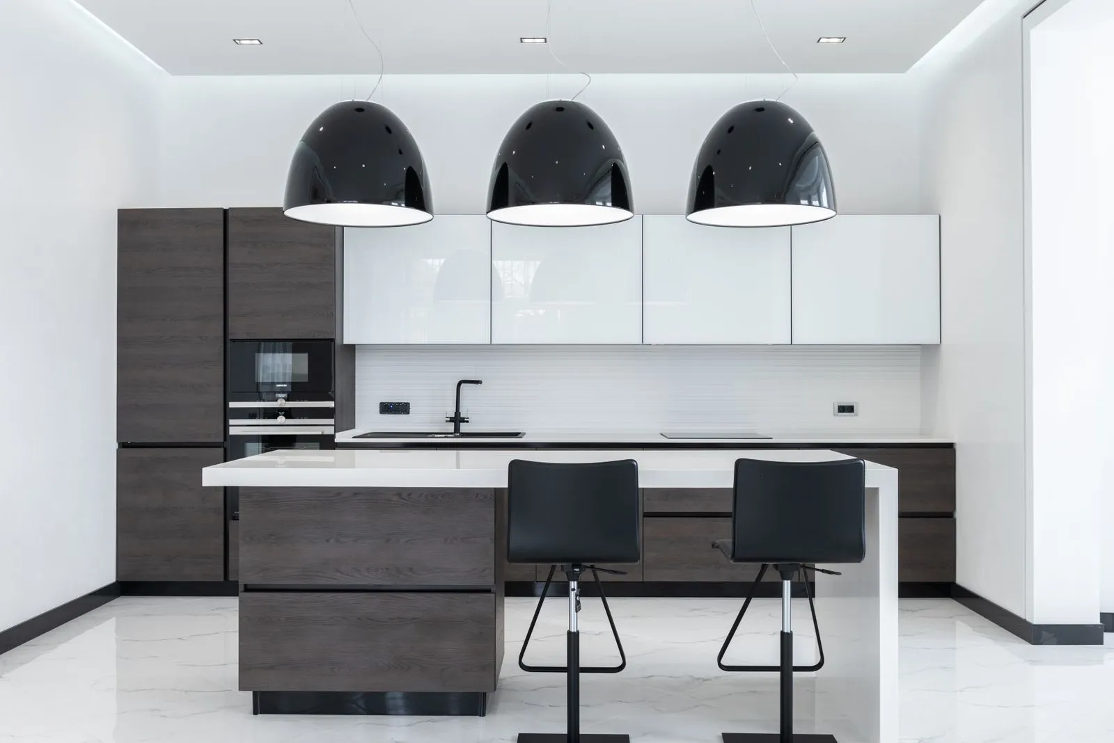 Pendant lighting installed above a kitchen island bench